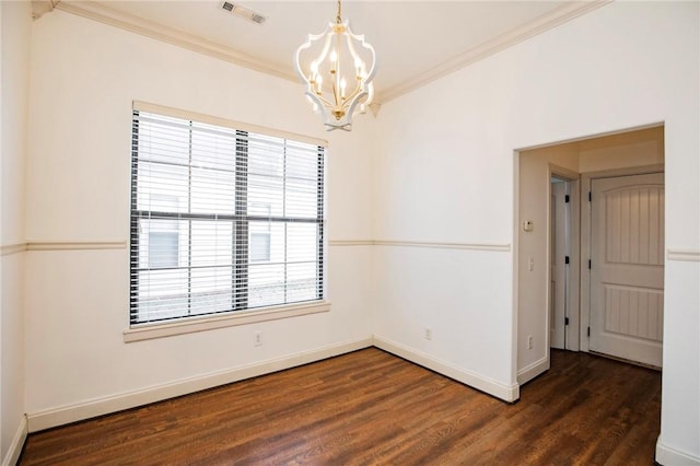 empty room featuring crown molding, dark hardwood / wood-style flooring, a healthy amount of sunlight, and an inviting chandelier