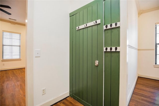 room details featuring hardwood / wood-style floors, ceiling fan, and crown molding