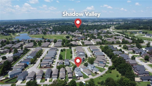 bird's eye view featuring a residential view and a water view