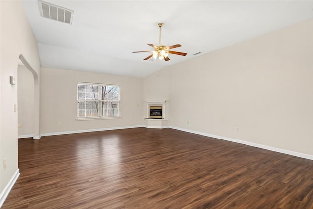 unfurnished living room featuring dark hardwood / wood-style floors, ceiling fan, and lofted ceiling