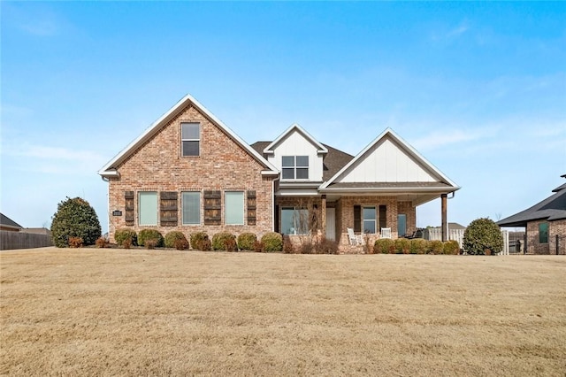 craftsman-style home featuring a front yard and a porch