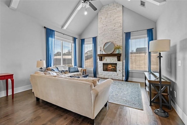 living room featuring dark hardwood / wood-style flooring, a wealth of natural light, and ceiling fan