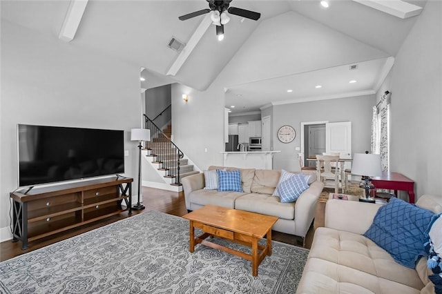 living room with hardwood / wood-style flooring, high vaulted ceiling, ceiling fan, and ornamental molding