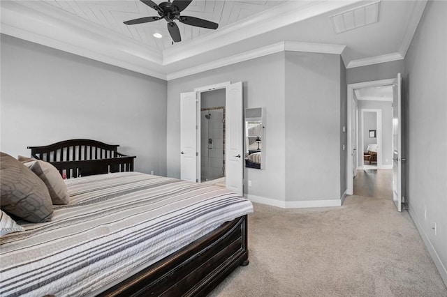 carpeted bedroom featuring a tray ceiling, ceiling fan, and crown molding