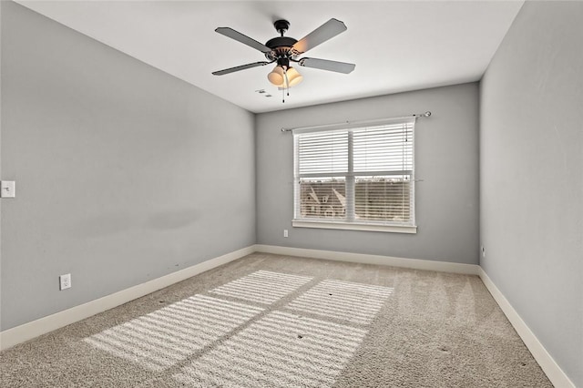 unfurnished room featuring light carpet and ceiling fan