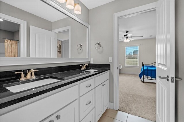 bathroom featuring ceiling fan, tile patterned flooring, and vanity