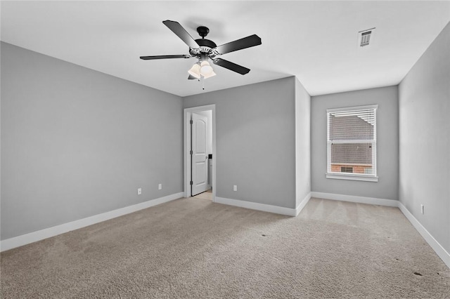 carpeted empty room with ceiling fan