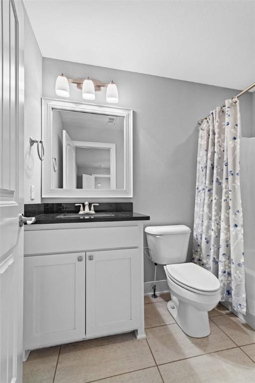 full bathroom with tile patterned flooring, shower / bath combo, toilet, and vanity