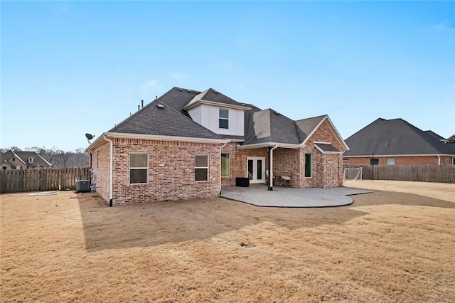 view of front of home featuring a patio area and cooling unit