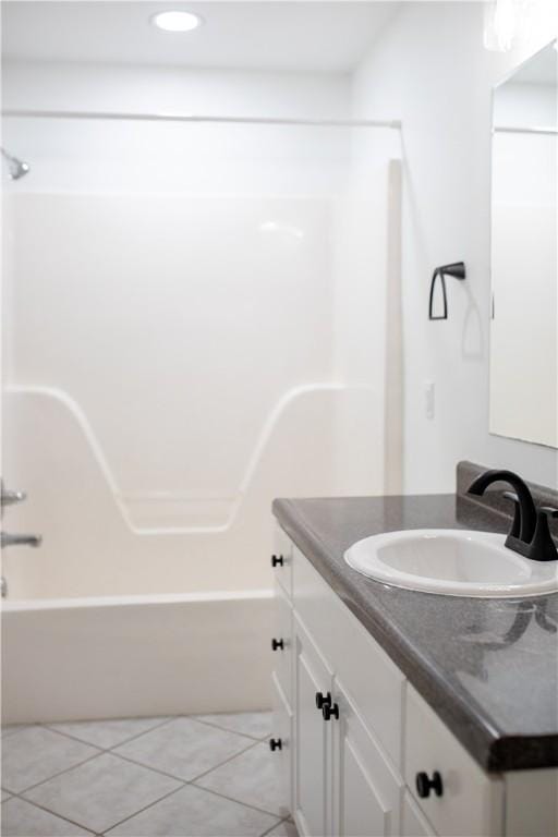 bathroom featuring vanity, shower / bathtub combination, and tile patterned floors