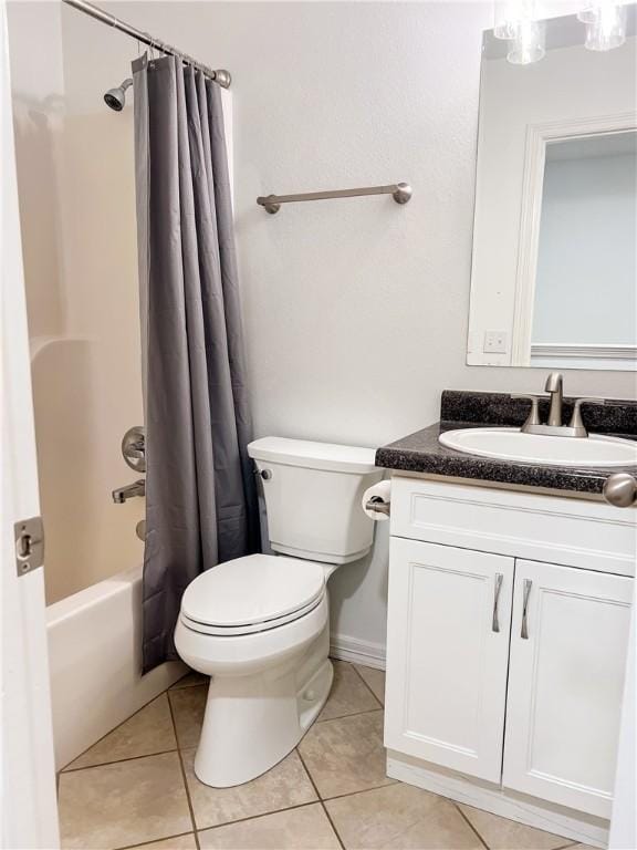 full bathroom featuring toilet, tile patterned floors, vanity, and shower / bathtub combination with curtain