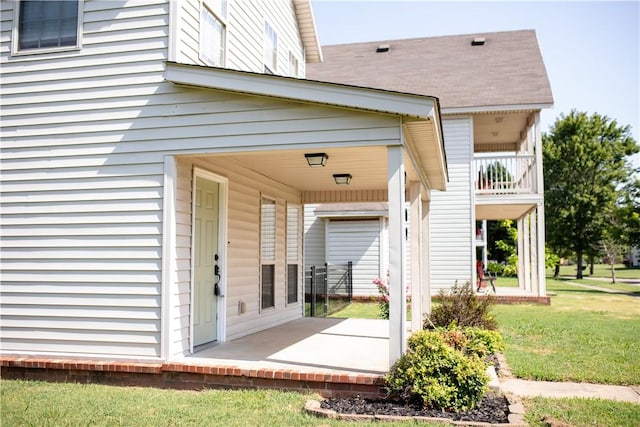 view of exterior entry featuring a patio area