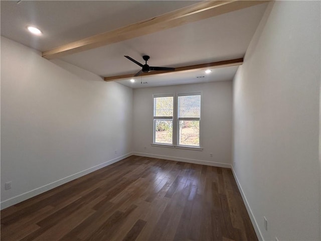 spare room featuring beamed ceiling, dark hardwood / wood-style flooring, and ceiling fan