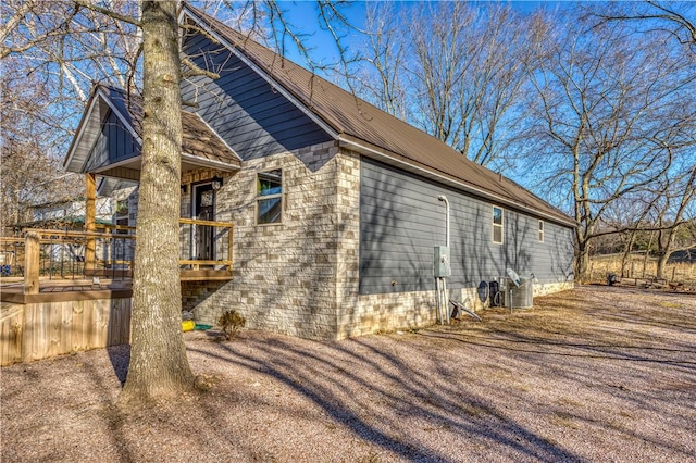 view of side of home featuring a deck