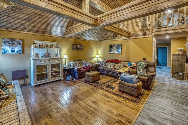 living room with hardwood / wood-style floors, vaulted ceiling with beams, and wood ceiling