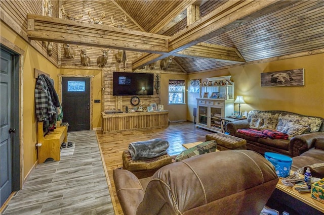 living room with high vaulted ceiling and wooden ceiling