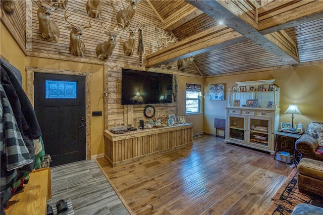 living room with hardwood / wood-style flooring, high vaulted ceiling, and wooden ceiling