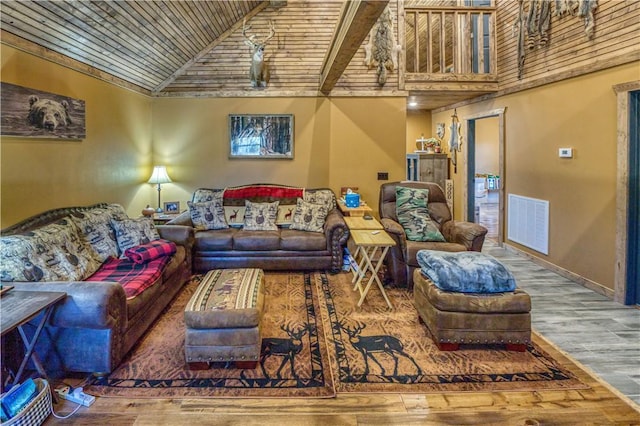 living room featuring hardwood / wood-style flooring, high vaulted ceiling, and wood ceiling