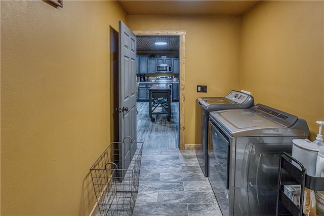 laundry area with independent washer and dryer