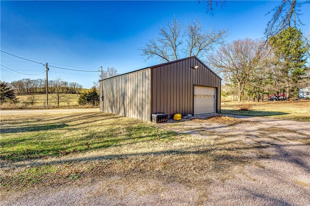 garage featuring a lawn