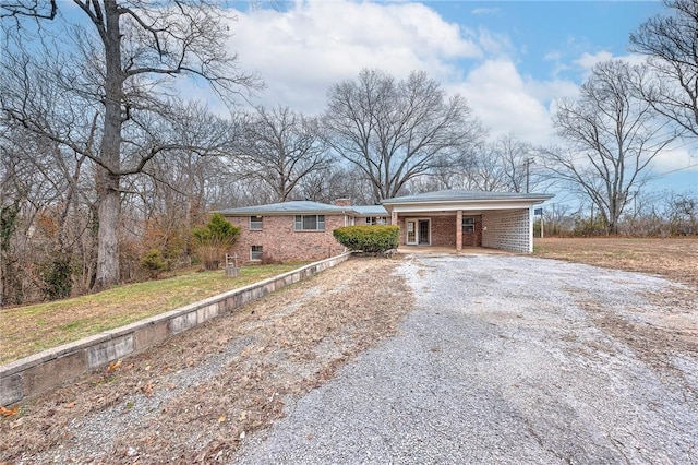 ranch-style home with a carport