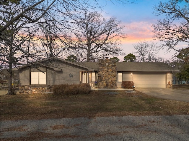 ranch-style home featuring a garage