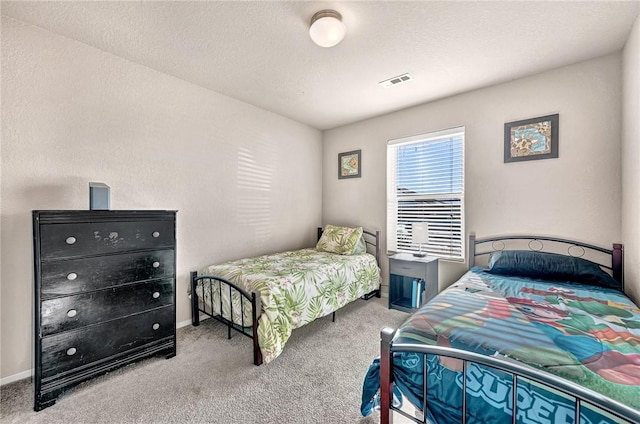 bedroom with light carpet