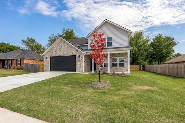 view of property with a garage and a front lawn