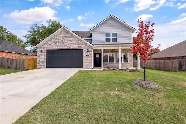 view of front of house with a garage and a front lawn