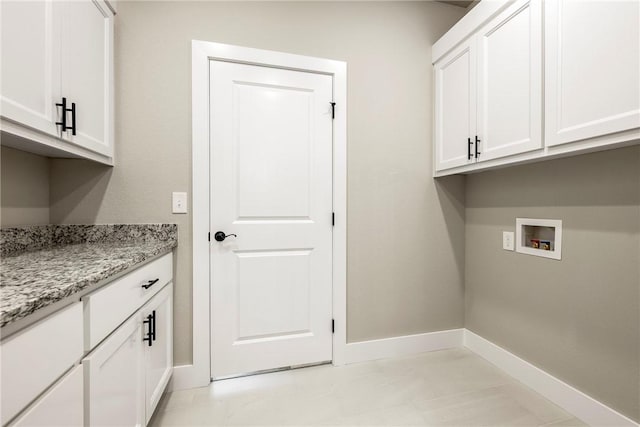 washroom with cabinets and washer hookup