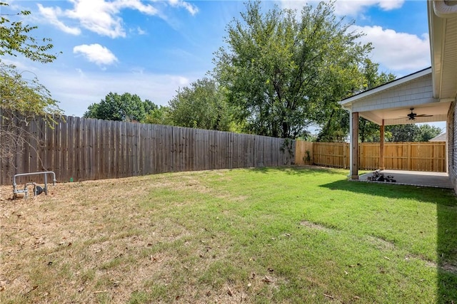 view of yard with ceiling fan