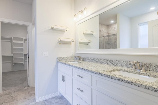 bathroom featuring vanity and a shower with shower door