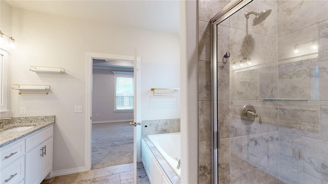 bathroom with vanity and separate shower and tub