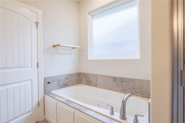 bathroom with a tub to relax in