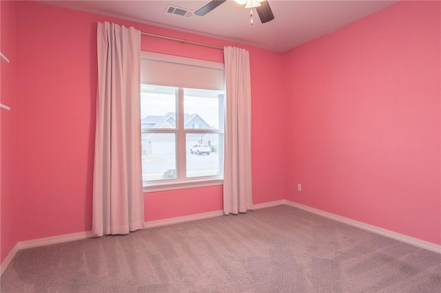 spare room with ceiling fan and carpet floors