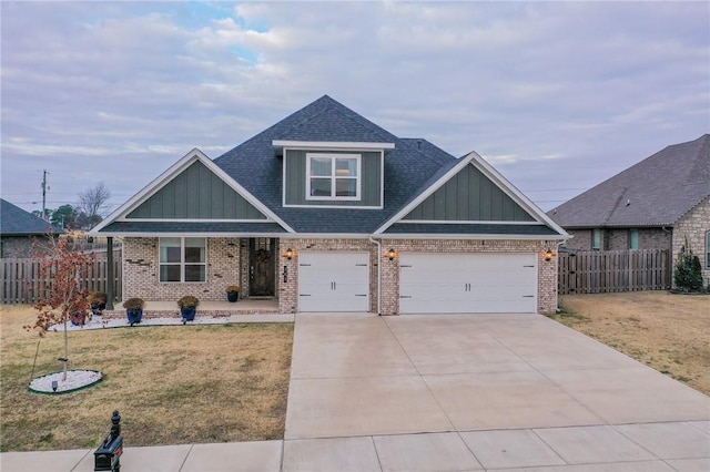 view of front of house featuring a front yard and a garage