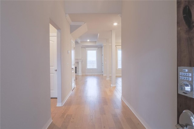 corridor with light hardwood / wood-style flooring