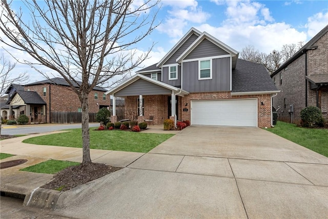 craftsman-style house featuring a garage and a front lawn