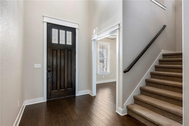 empty room with dark hardwood / wood-style floors and ceiling fan