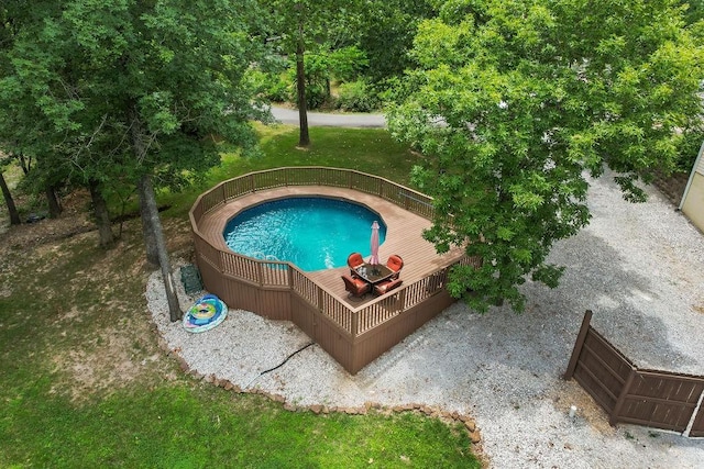 view of swimming pool featuring a deck