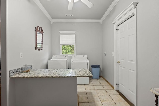 clothes washing area featuring laundry area, light tile patterned floors, visible vents, ornamental molding, and washer and dryer