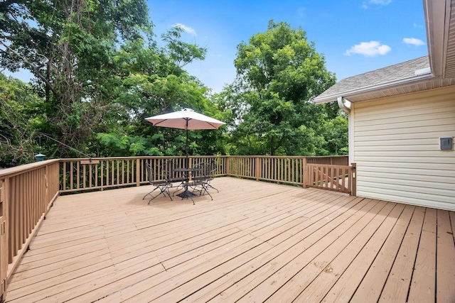 wooden deck featuring outdoor dining space