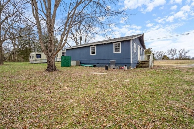 view of home's exterior with a yard