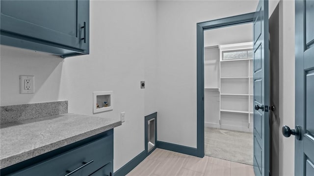 washroom featuring hookup for an electric dryer, cabinets, light carpet, and hookup for a washing machine