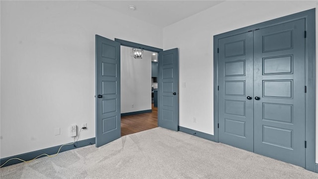 bedroom featuring dark carpet and a closet