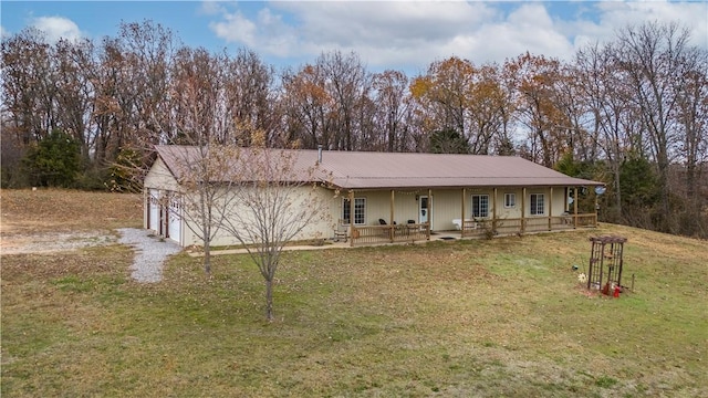 ranch-style house with a porch, a garage, and a front lawn