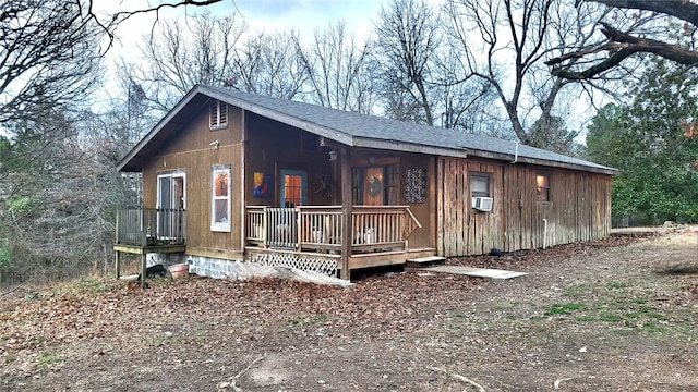 exterior space with covered porch and cooling unit