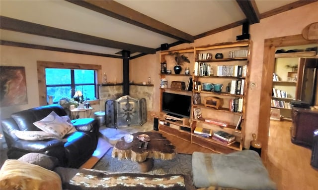 living room featuring beam ceiling and hardwood / wood-style floors