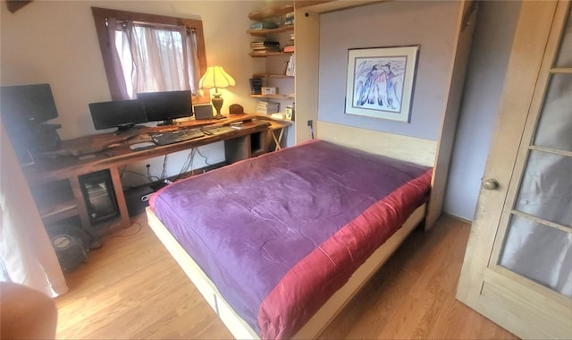 bedroom with light hardwood / wood-style floors