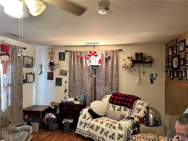 living room with ceiling fan and hardwood / wood-style floors